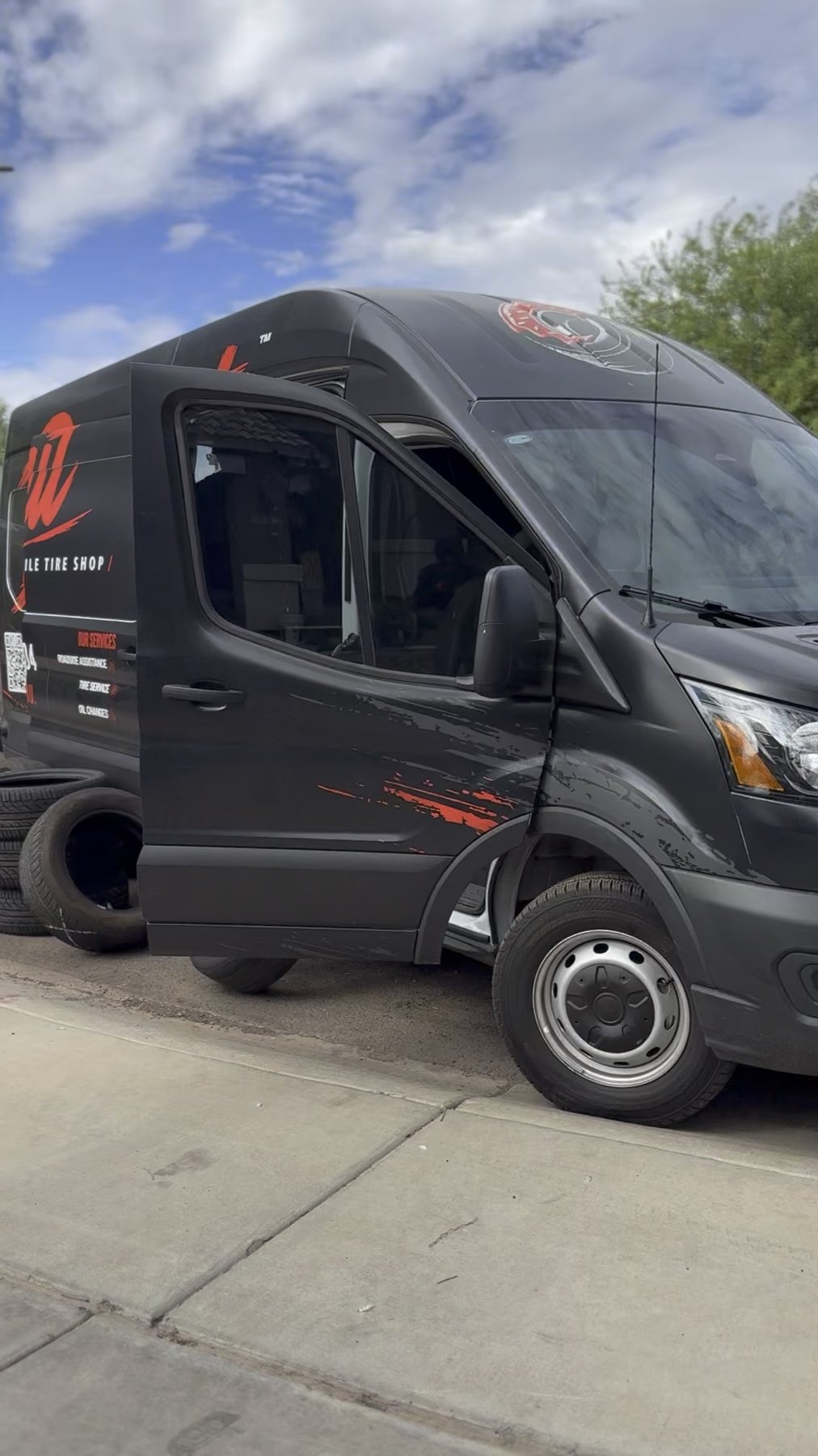 Donut Mobile Tire van on site with tires out for a flat tire repair in Phoenix