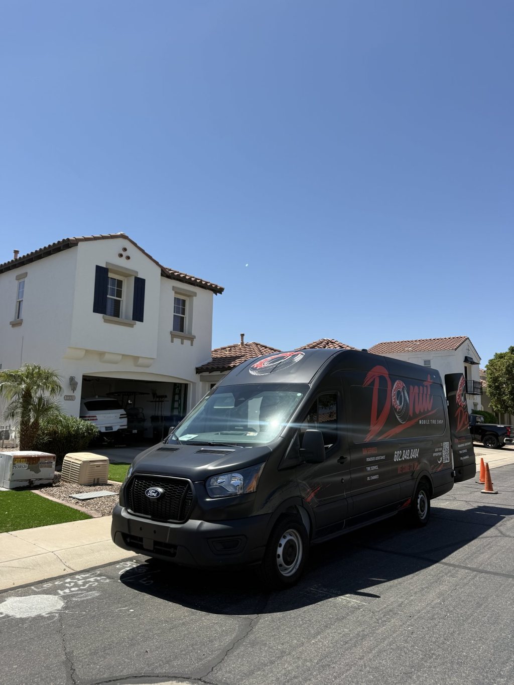 Donut Mobile Tire van parked outside a customer's home for an at-home tire change